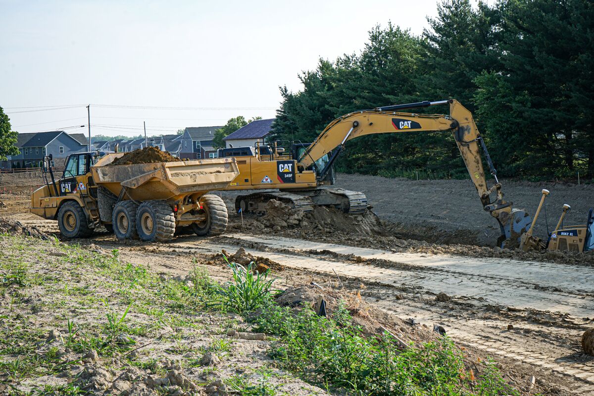 excavator and dump truck on a site
